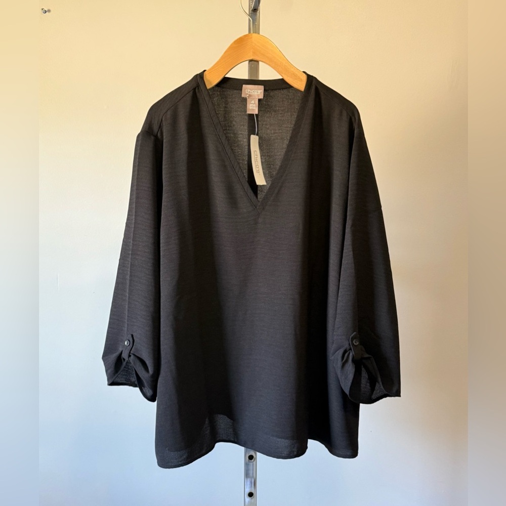 Chico’s..Textured blouse V-neckline wide sleeves with a rolled-up button detail